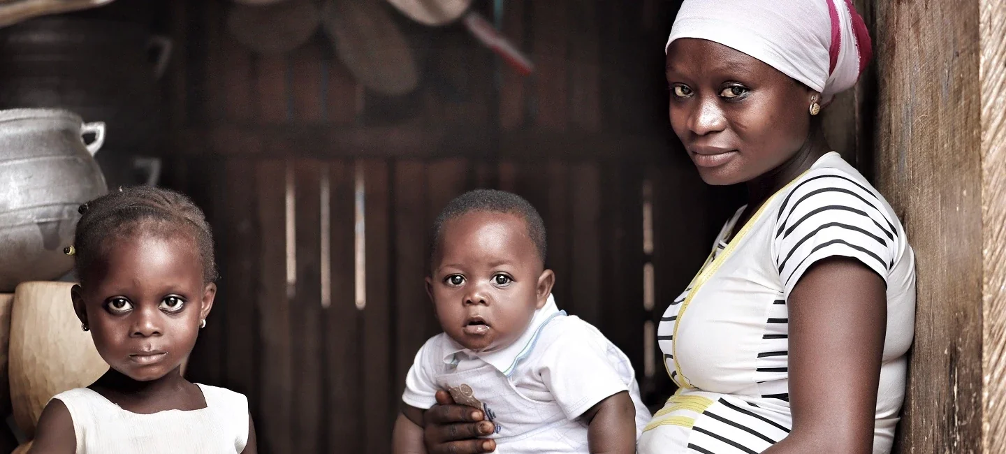 A mother with her young children at home