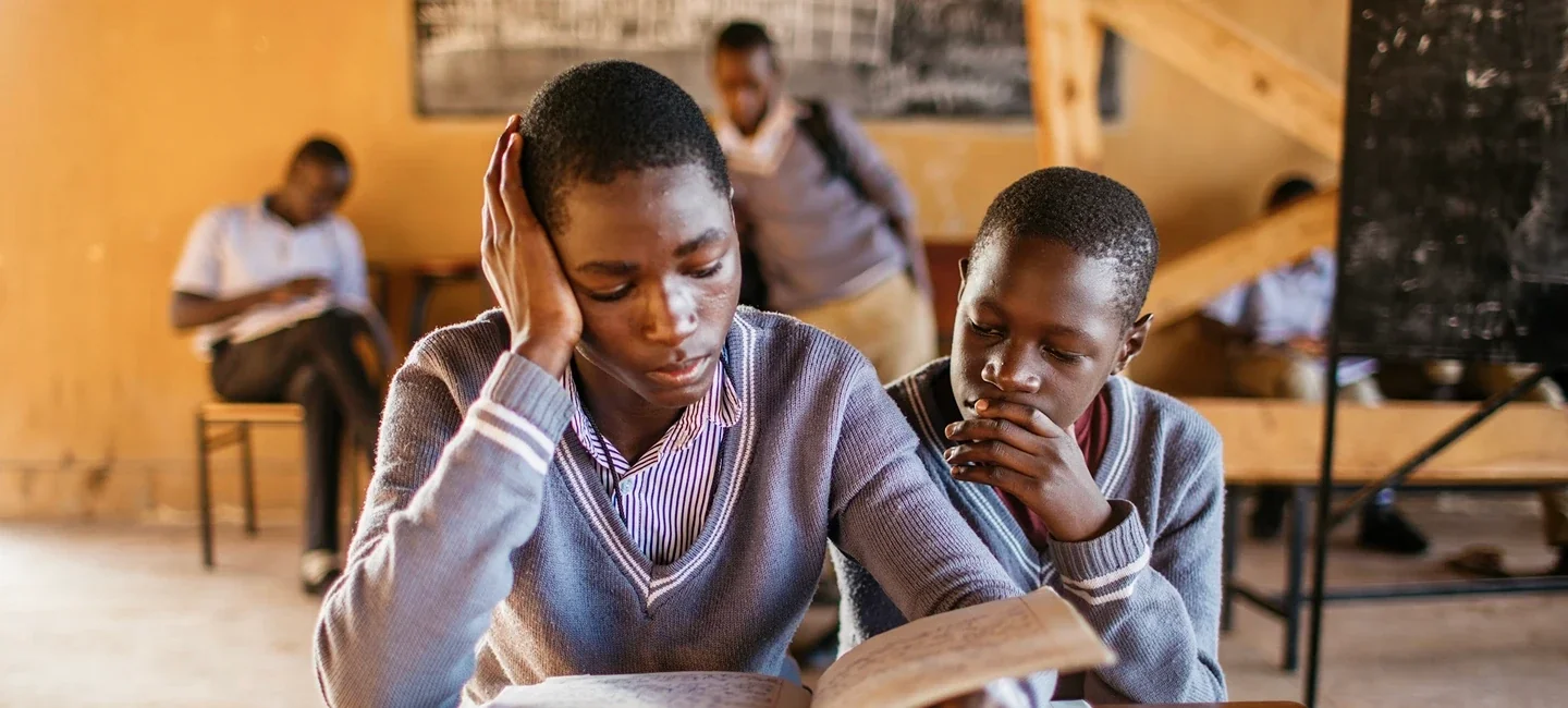 Two students studying together in a classroom